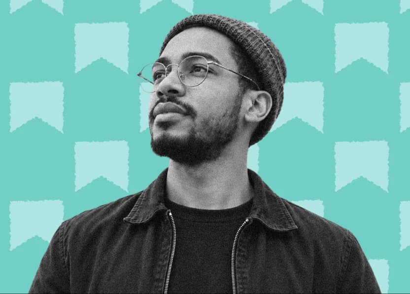 A chapter organizer in a beanie and glasses, looking ahead